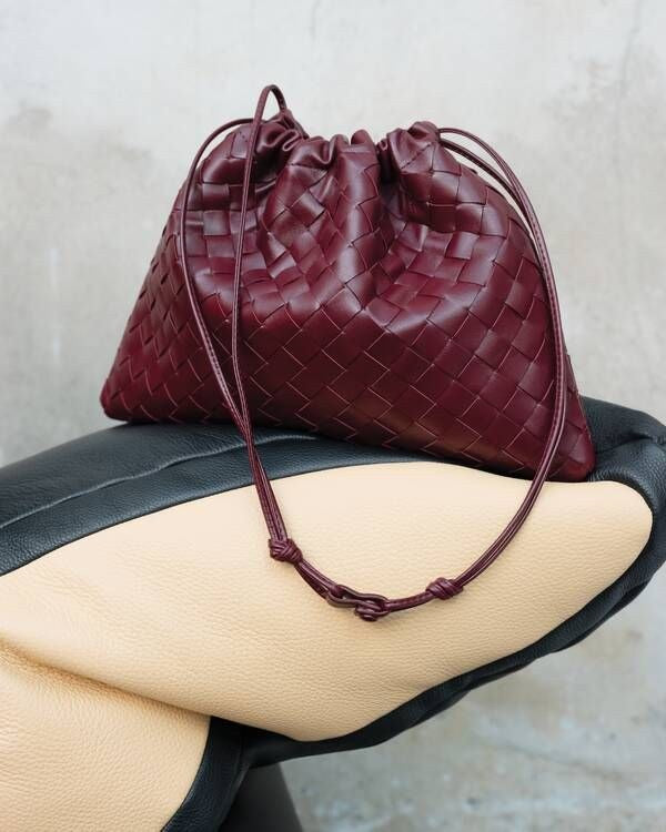 The Matera Woven Pouch — worn