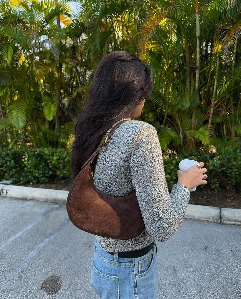 The Cassis Crescent Bag — worn