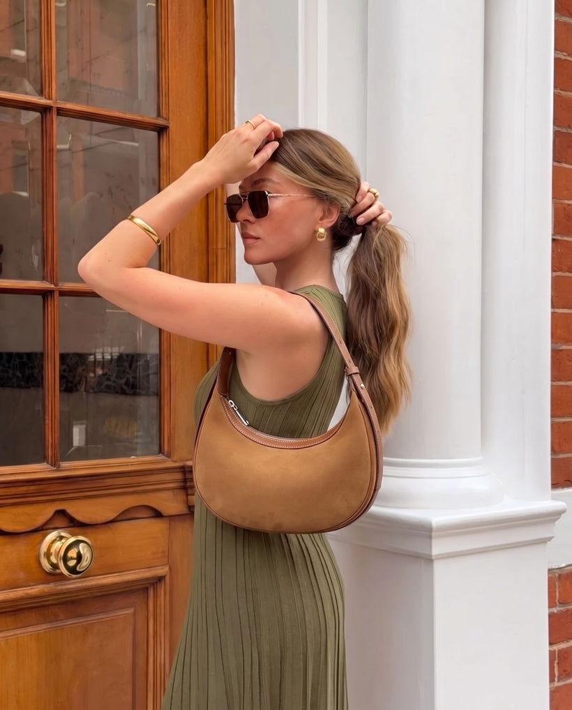The Cassis Crescent Bag in Caramel, styled