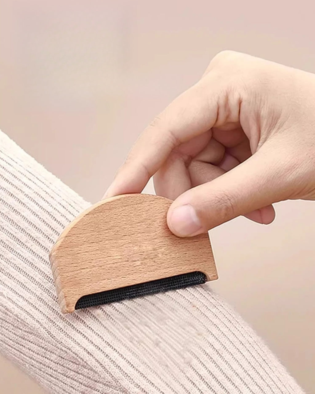 The Beechwood Cashmere Comb in use on a ribbed knit sleeve