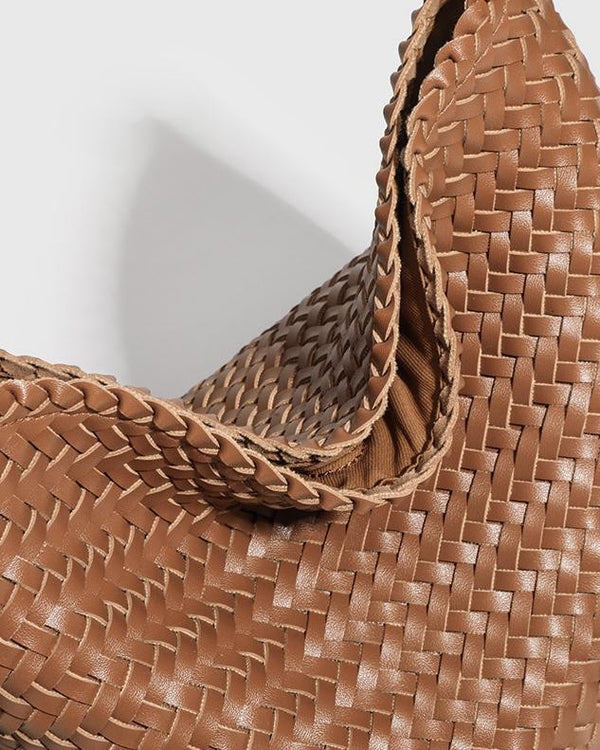 The Lecce Woven Bucket, close-up of the open top with the strap slider