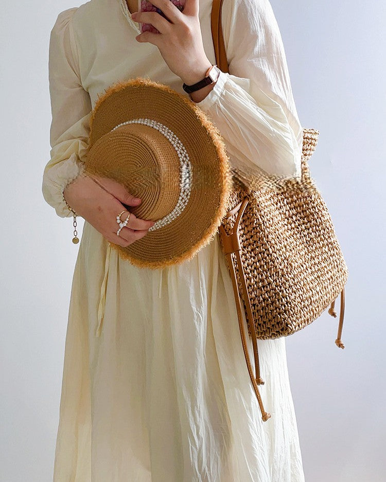 Wildfool Straw Bucket Bag in Cream - Styled on Model - Hand-Woven Straw, Drawstring Closure, Lined Interior
