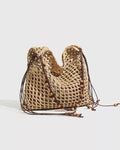Wildfool Beaded Grass Tote in Black — three-quarter view, strap over shoulder
