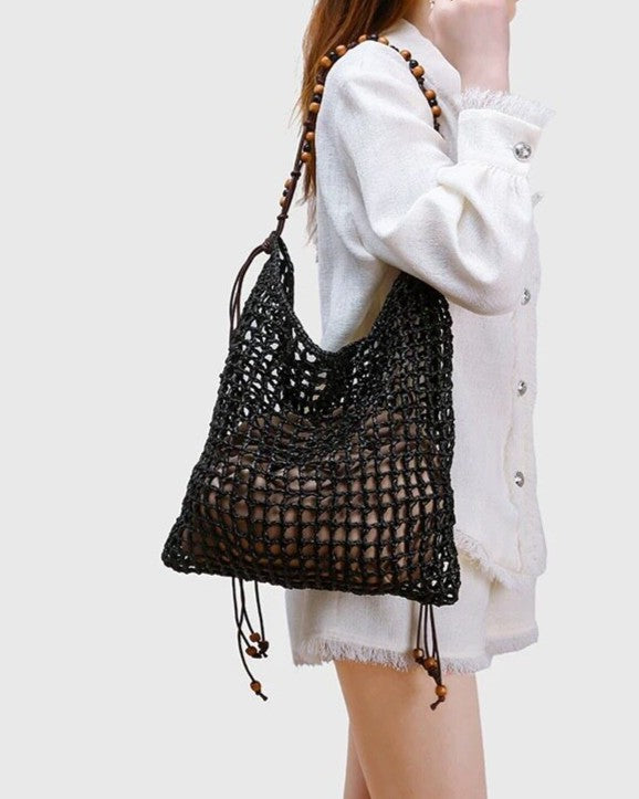 Wildfool Beaded Grass Tote in Black - Styled on Model - PP Straw Weave, Beaded Detail, Drawstring Closure