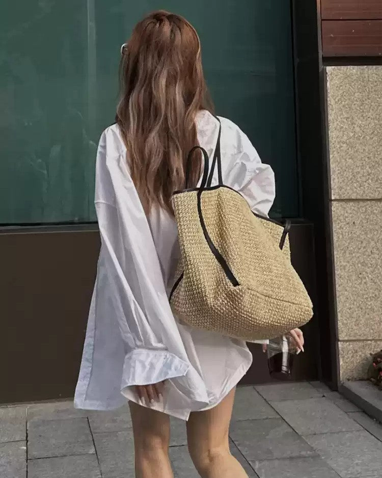 Brown woven tote detail — buckle and drawstring closure mechanisms