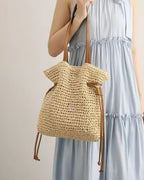Wildfool Straw Bucket Bag in Khaki - Styled on Model - Hand-Woven Straw, Drawstring Closure, Lined Interior
