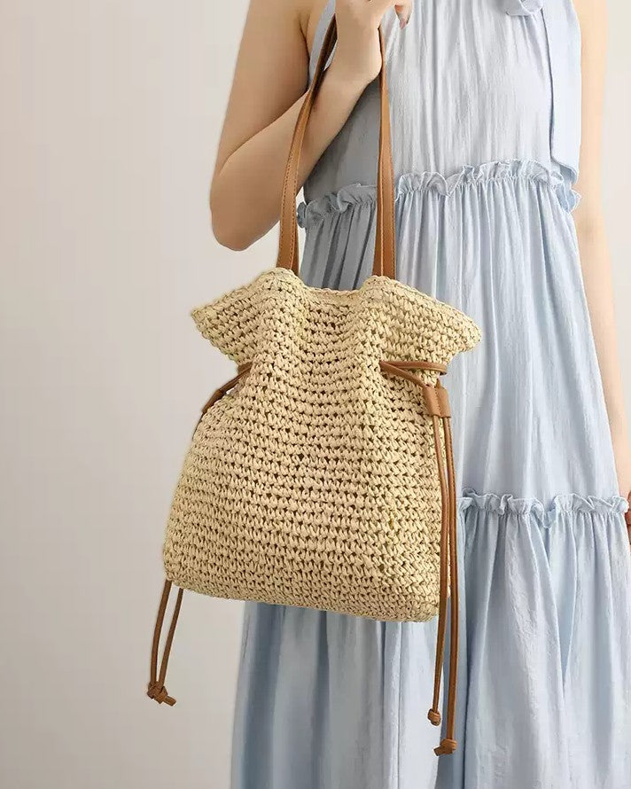Wildfool Straw Bucket Bag in Khaki - Styled on Model - Hand-Woven Straw, Drawstring Closure, Lined Interior