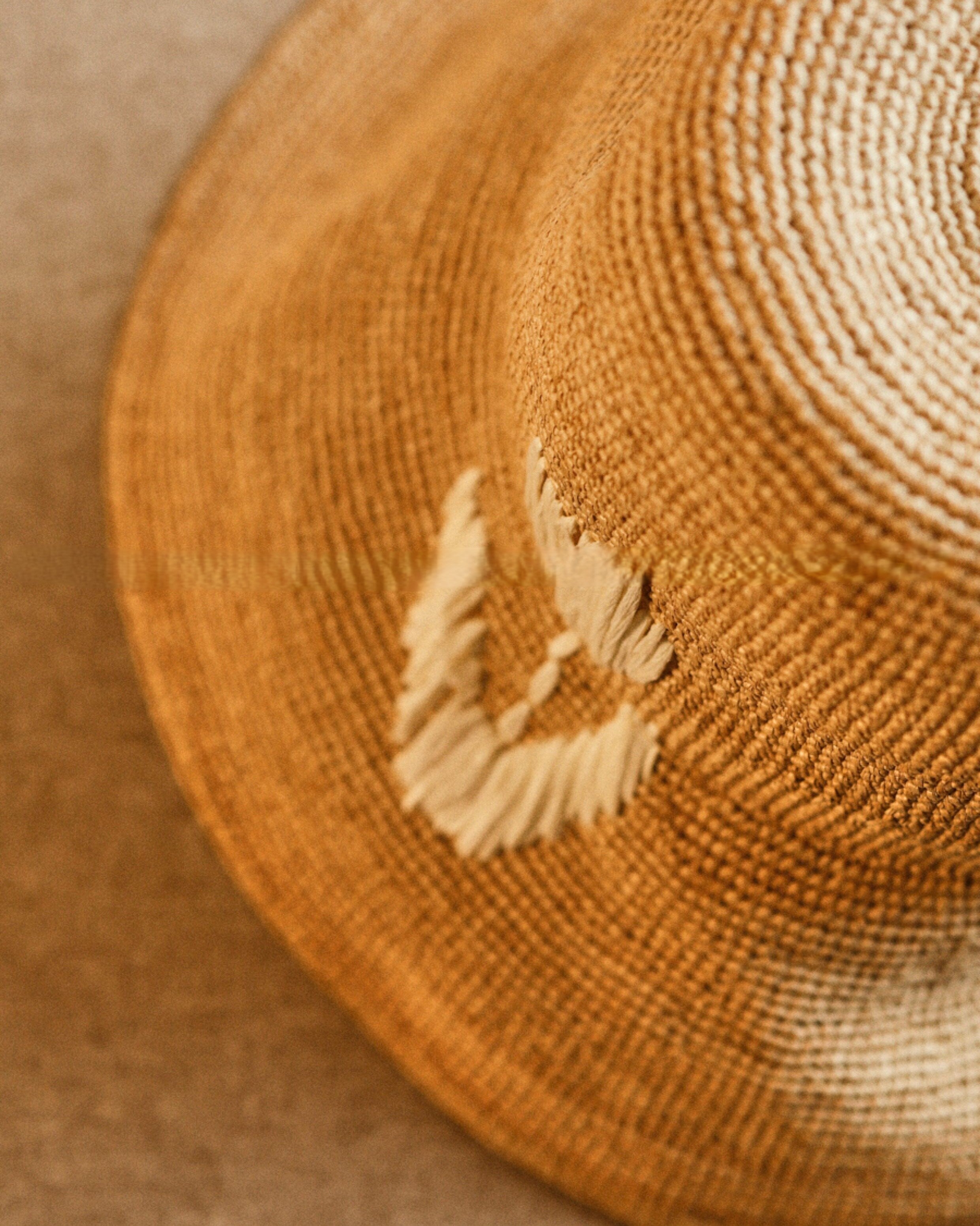 Wildfool Raffia Tulip Sun Hat in Honey — lifestyle outdoor setting, natural light