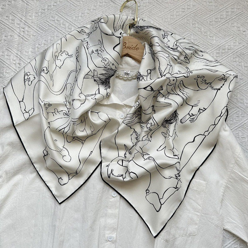 Line-drawn rabbit motif detail on white mulberry silk — Wildfool square scarf close-up