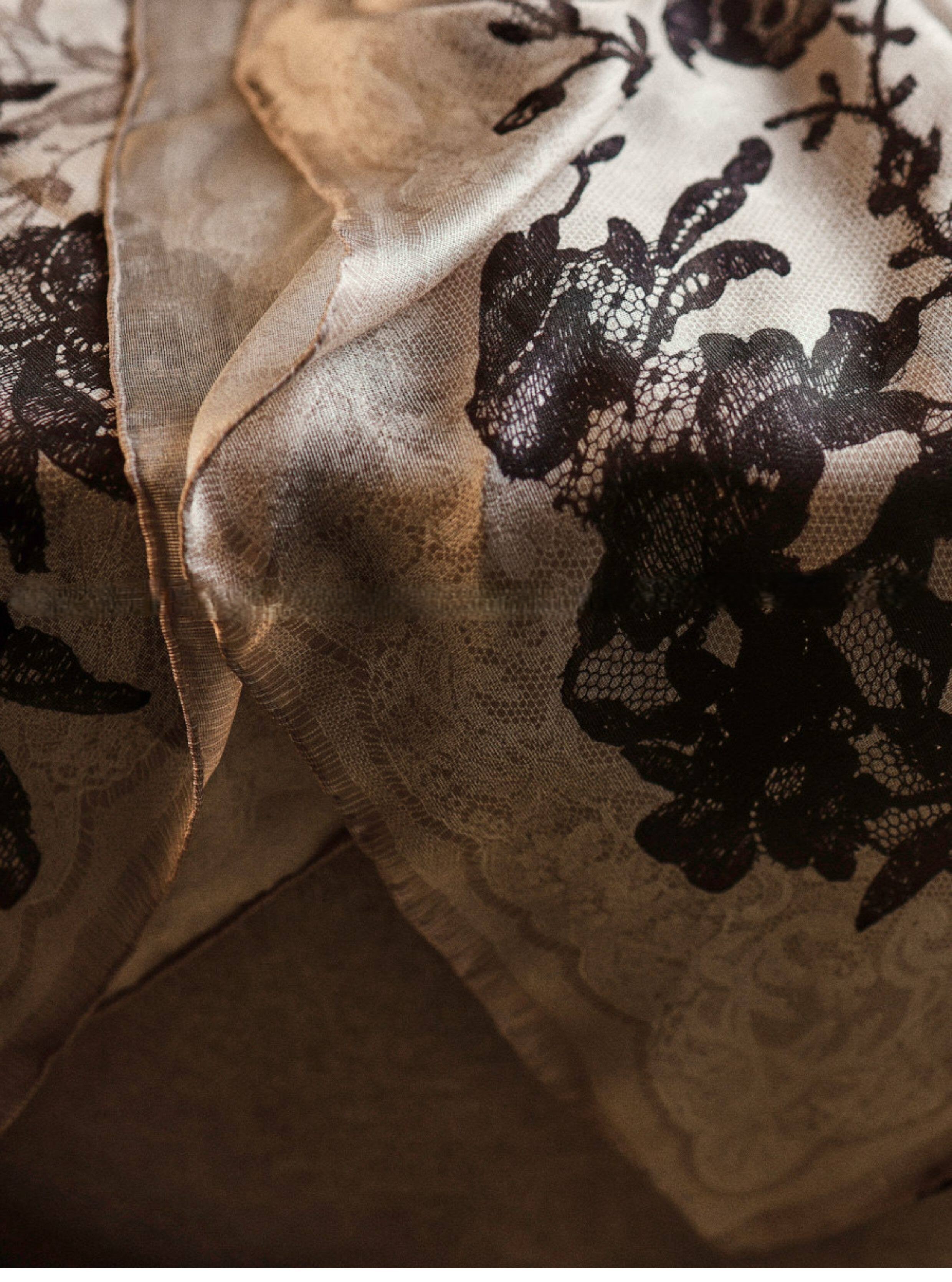 Wildfool silk chiffon scarf with lace floral print — held to light showing transparency