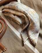 Wildfool 65cm silk wool scarf folded to show both gold and silver sides simultaneously