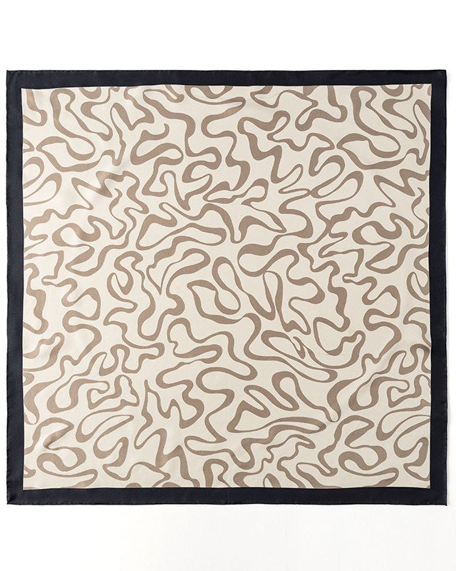 Close-up showing warm brown brushstroke-like curves flowing across mulberry silk in Matisse-inspired design