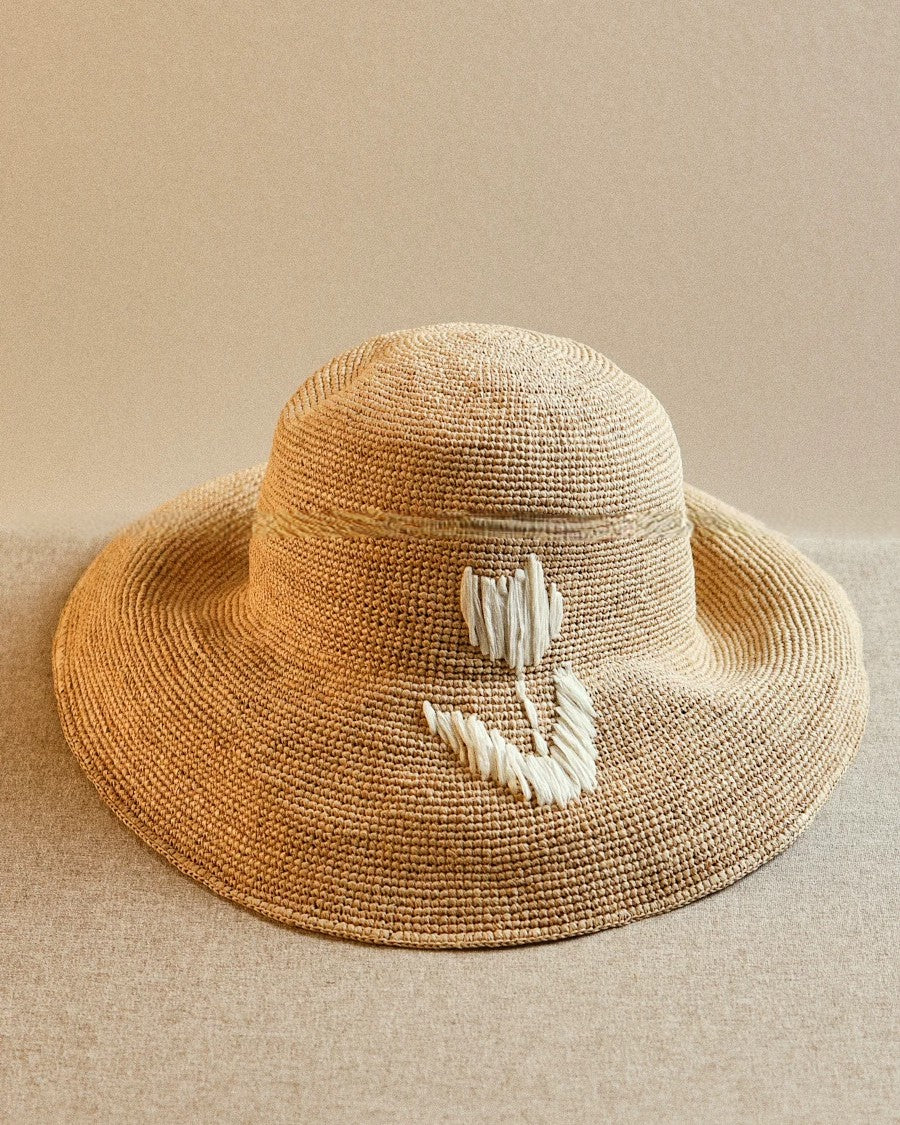 Wildfool Raffia Tulip Sun Hat in Honey — side profile showing 10cm wide brim drape