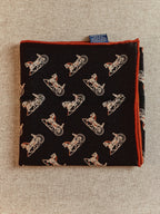 Reverse brick-red side of Wildfool silk wool carriage scarf showing cream line-drawn carriages