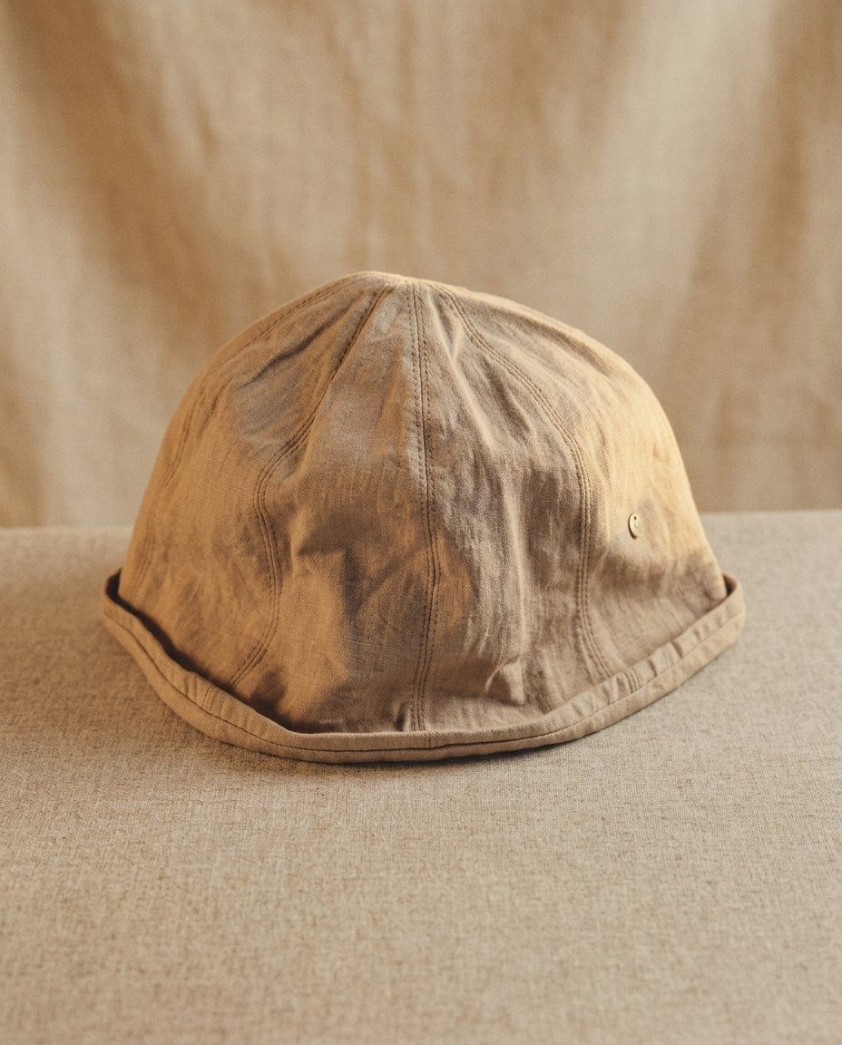 Wildfool Washed Linen Docker Cap in Khaki — side profile with metal eyelet detail