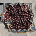 Wildfool reversible silk wool scarf — wine-red side with scattered white wildflower motifs