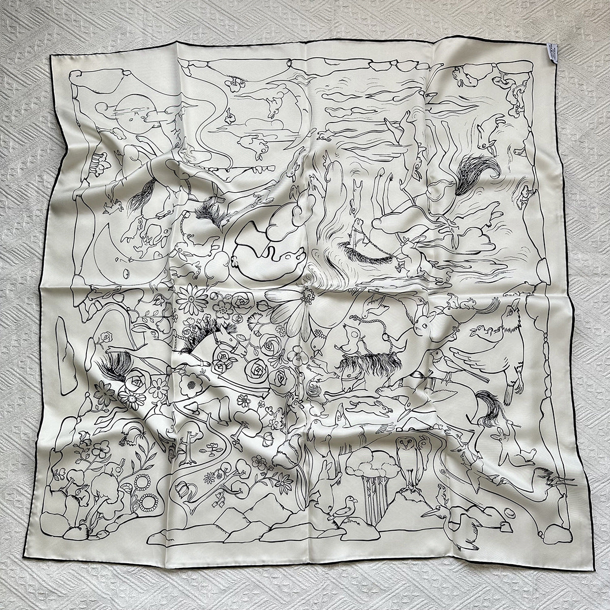 Wildfool 88cm mulberry silk scarf with line-drawn rabbit print — full flat lay on cream linen