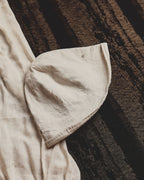 Wildfool Washed Linen Docker Cap in Black — three-quarter view showing minimal brim