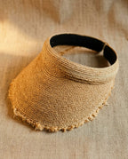 Wildfool Raffia Open-Crown Visor — lifestyle shot, natural light, outdoor setting