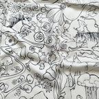 Wildfool mulberry silk square scarf in black and white rabbit motif — draped loosely over one shoulder