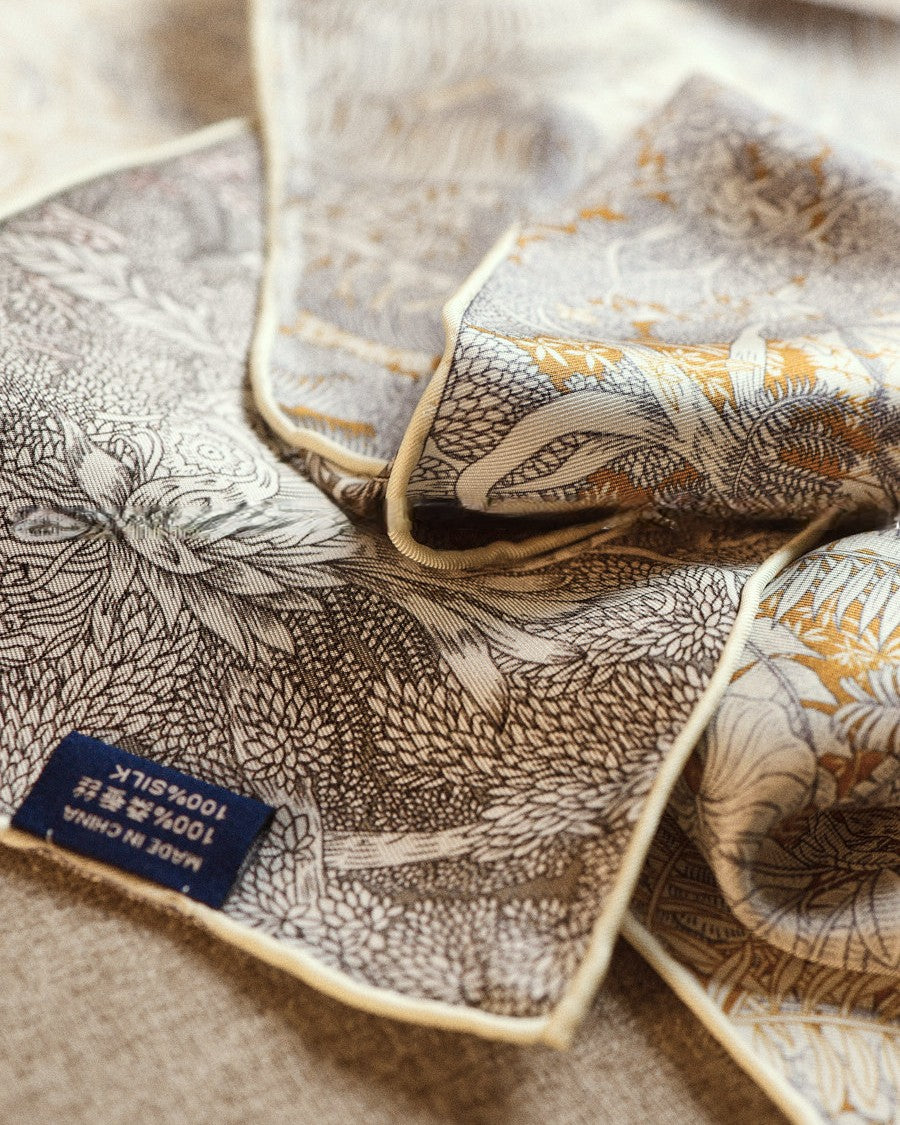 Close-up of silk wool blend texture showing tropical chrysanthemum botanical pattern
