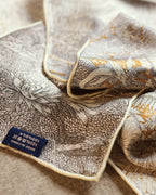 Close-up of silk wool blend texture showing tropical chrysanthemum botanical pattern