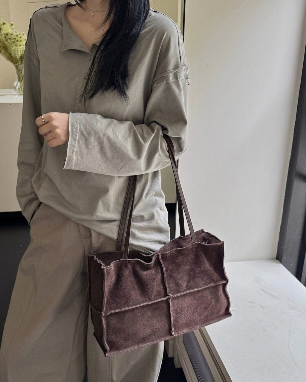 Wildfool The Urbino Patchwork Tote in Espresso, carried by hand