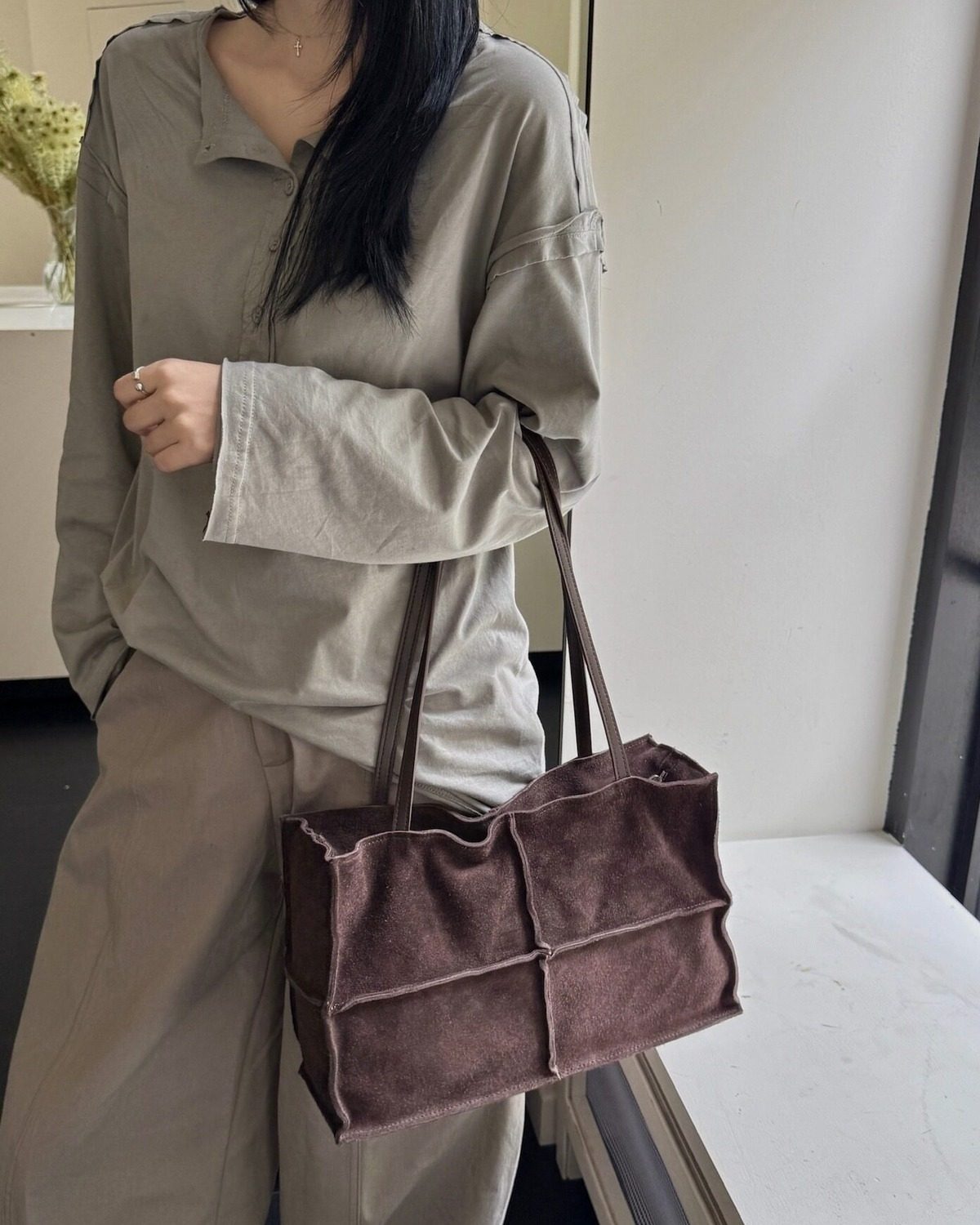 Wildfool The Urbino Patchwork Tote in Espresso, carried by hand