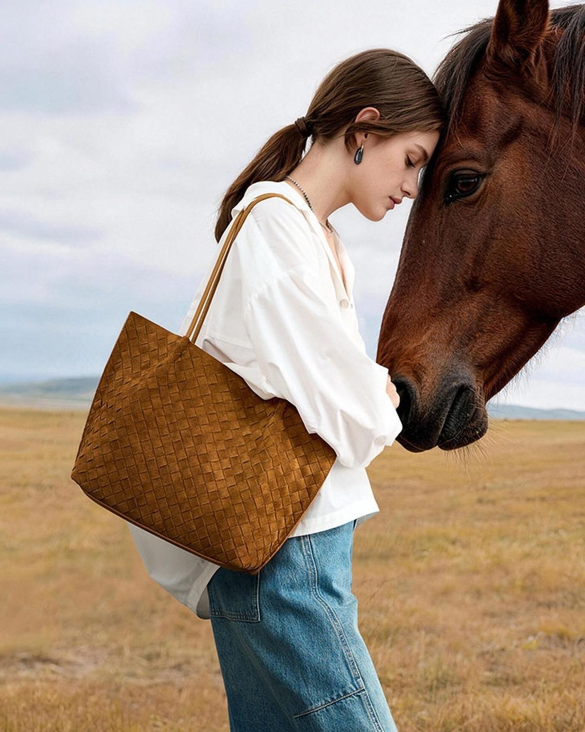 Wildfool The Perugia Woven Tote in Caramel, worn on the shoulder