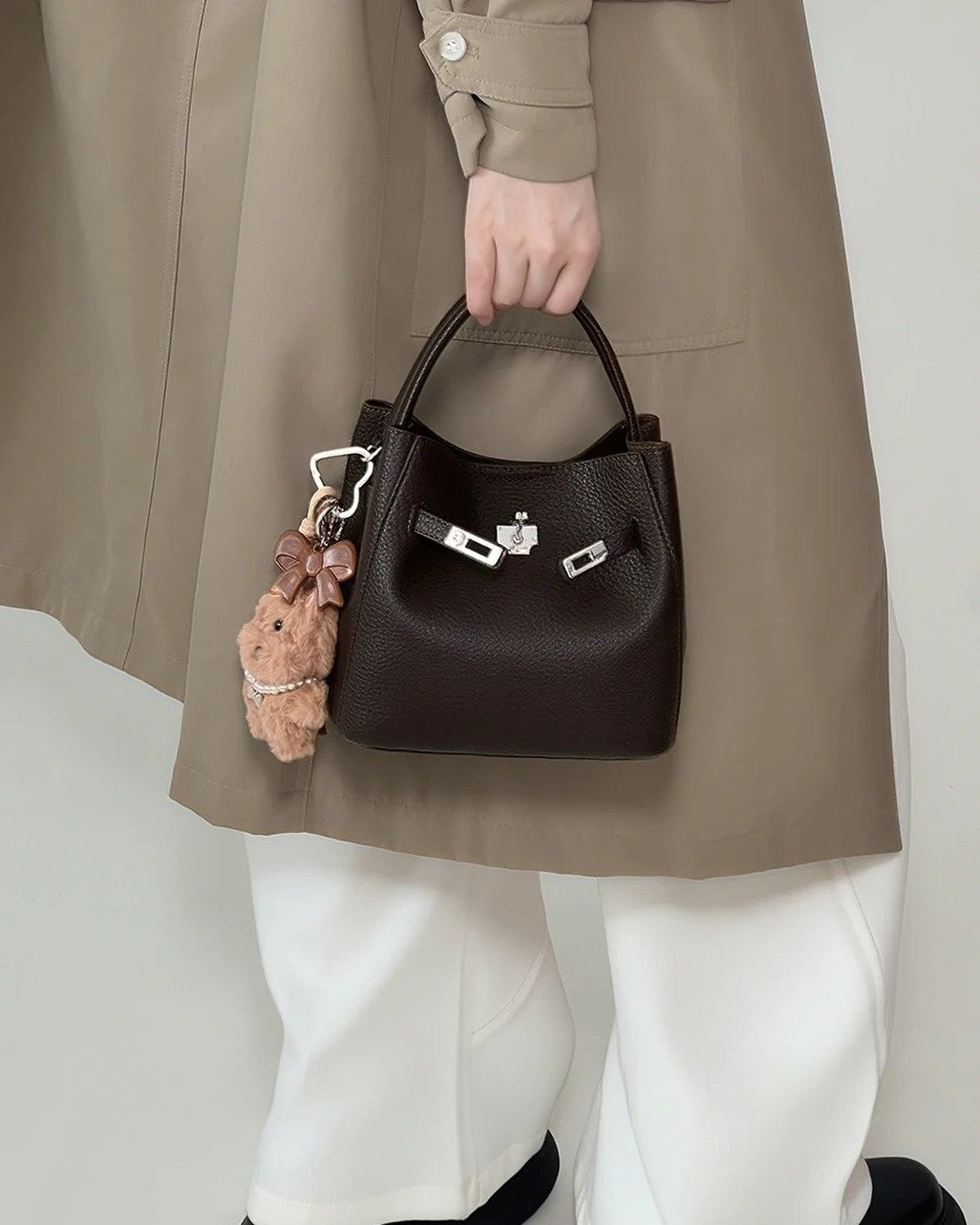 Wildfool The Orvieto Mini Bucket in Espresso, carried by hand