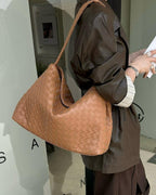 Wildfool The Treviso Woven Hobo in Caramel, worn on the shoulder