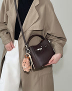 Wildfool The Orvieto Mini Bucket in Espresso, worn crossbody (2)