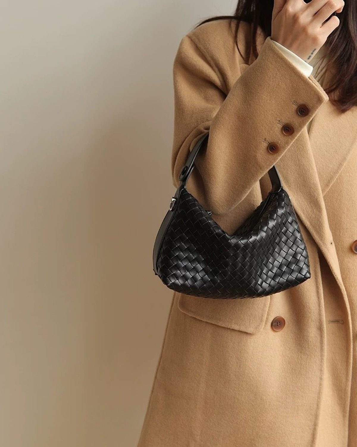 Wildfool The Parma Woven Mini Hobo in Black, carried by hand