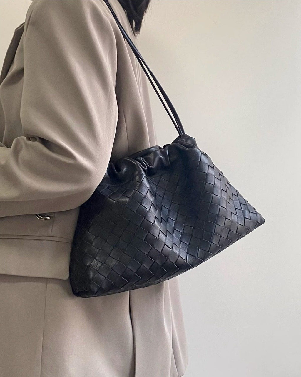 Wildfool The Assisi Chain Pouch in Black, worn on the shoulder