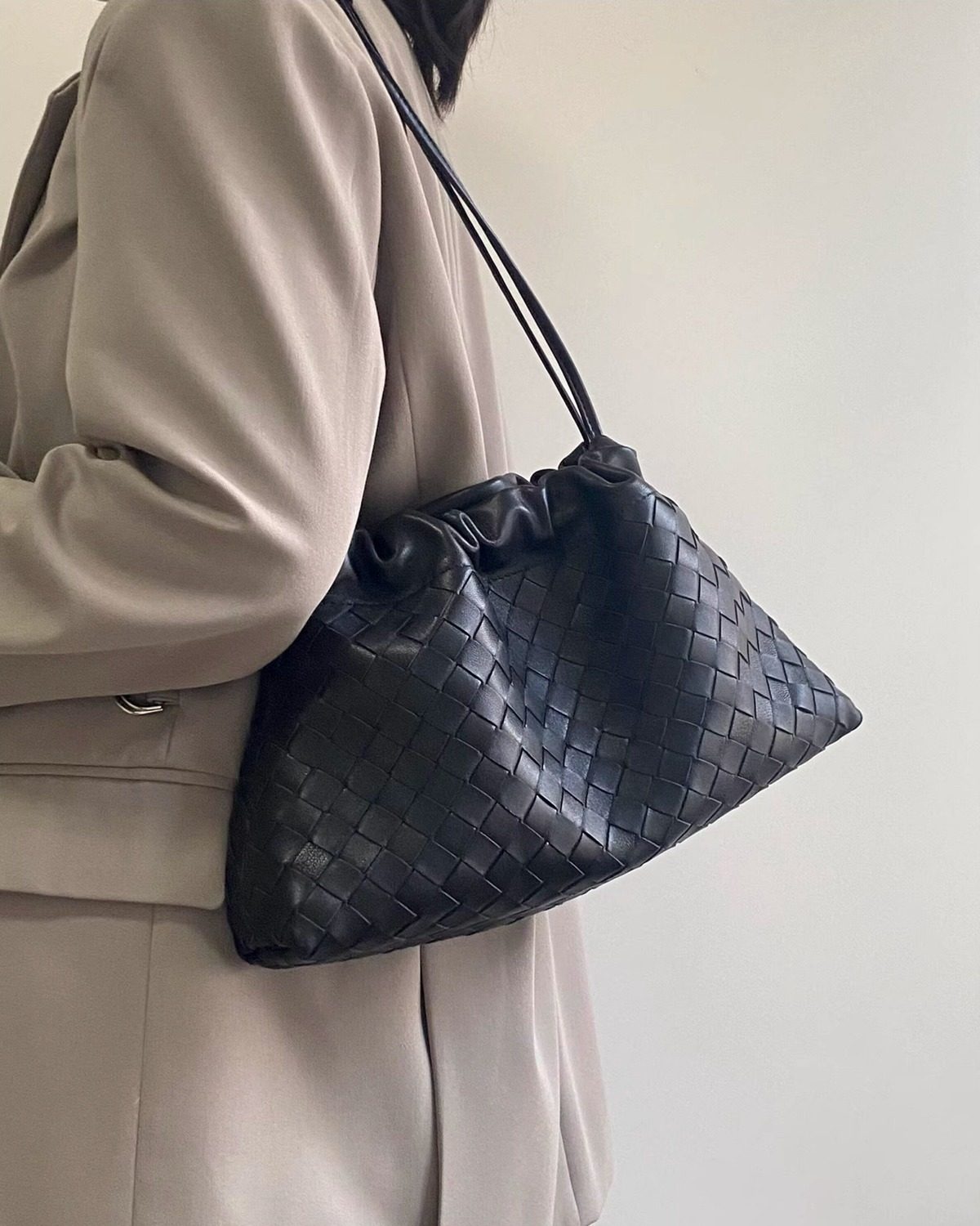 Wildfool The Assisi Chain Pouch in Black, worn on the shoulder