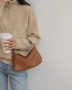 Wildfool The Parma Woven Mini Hobo in Caramel, carried by hand