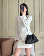 Wildfool The Assisi Chain Pouch in Black, worn on the shoulder (2)