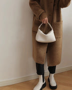 Wildfool The Parma Woven Mini Hobo in Ivory, carried by hand
