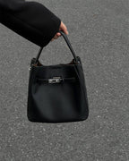 Wildfool The Orvieto Mini Bucket in Black, carried by hand, close up