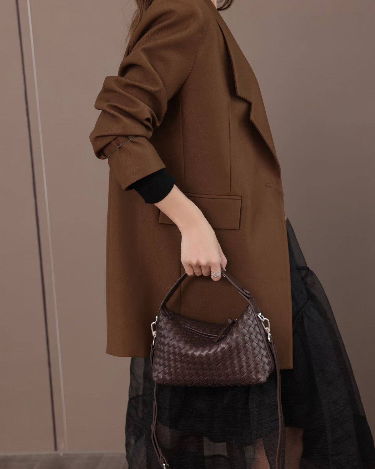 Wildfool The Parma Woven Mini Hobo in Espresso, carried by hand