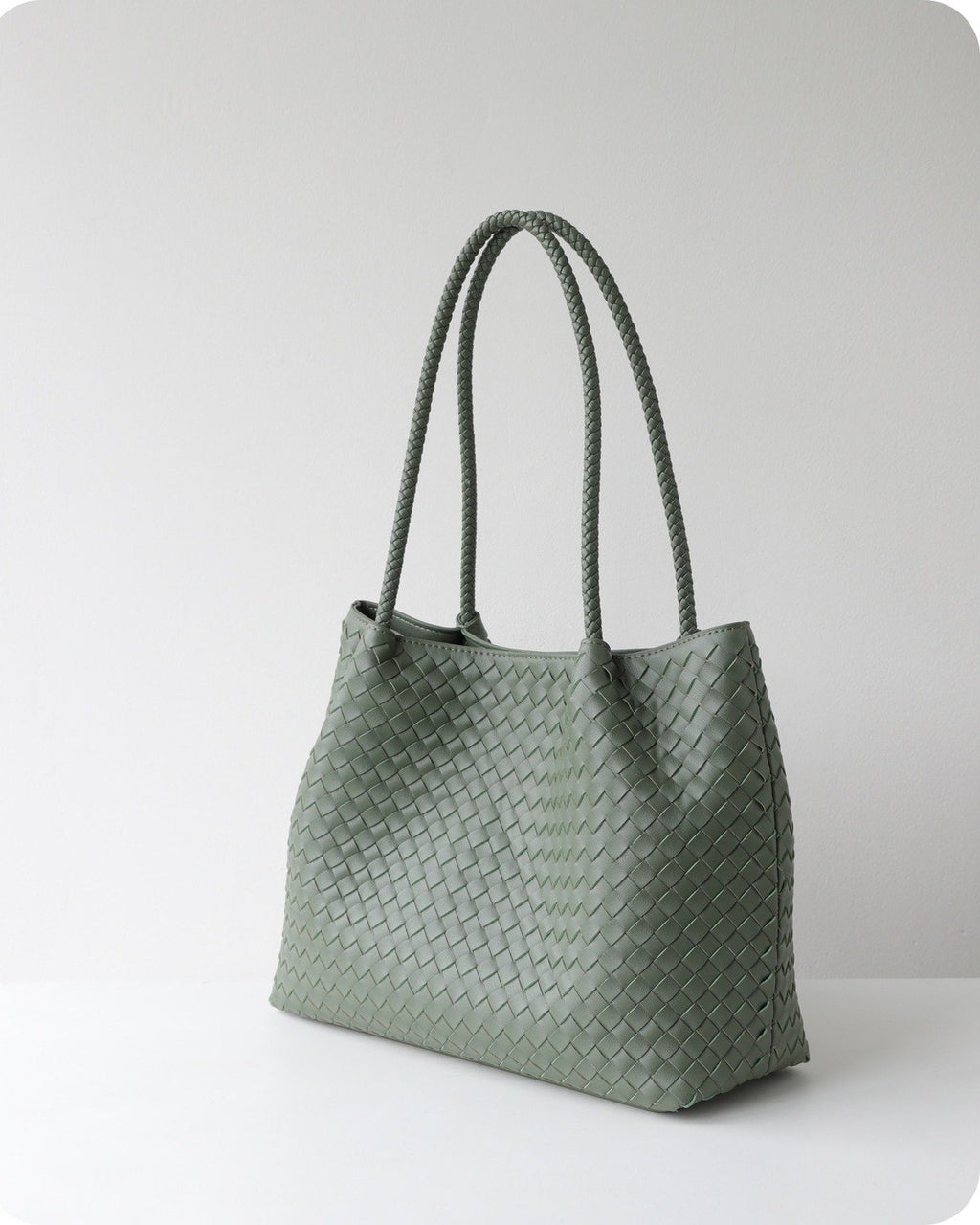 Wildfool The Vicenza Woven Tote in Sage Green, three-quarter view