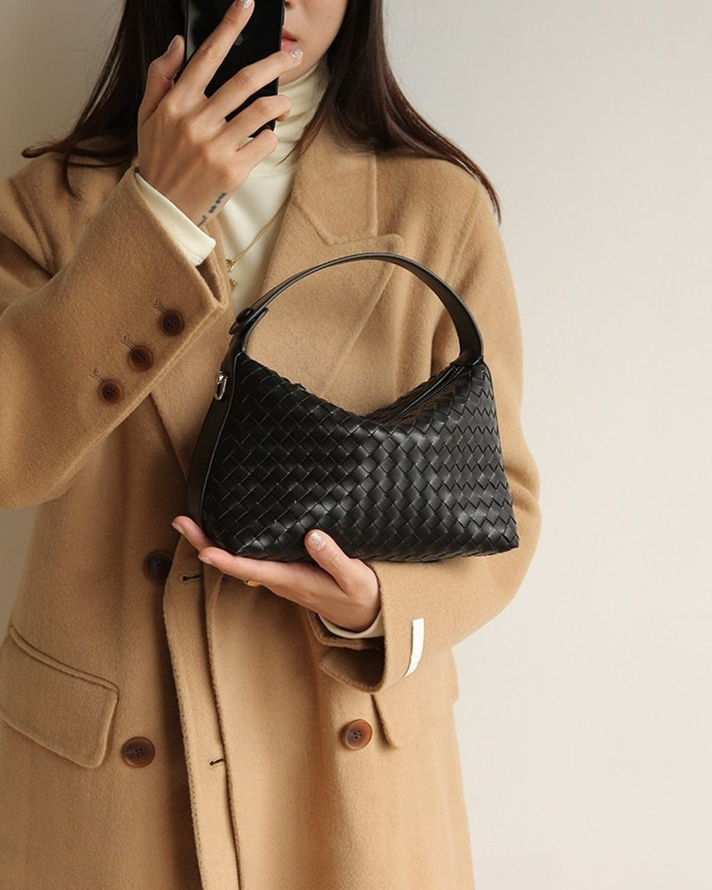Wildfool The Parma Woven Mini Hobo in Black, carried by hand, close up