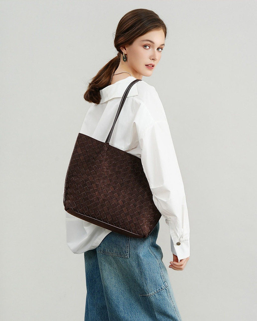Wildfool The Perugia Woven Tote in Chocolate, worn on the shoulder (2)
