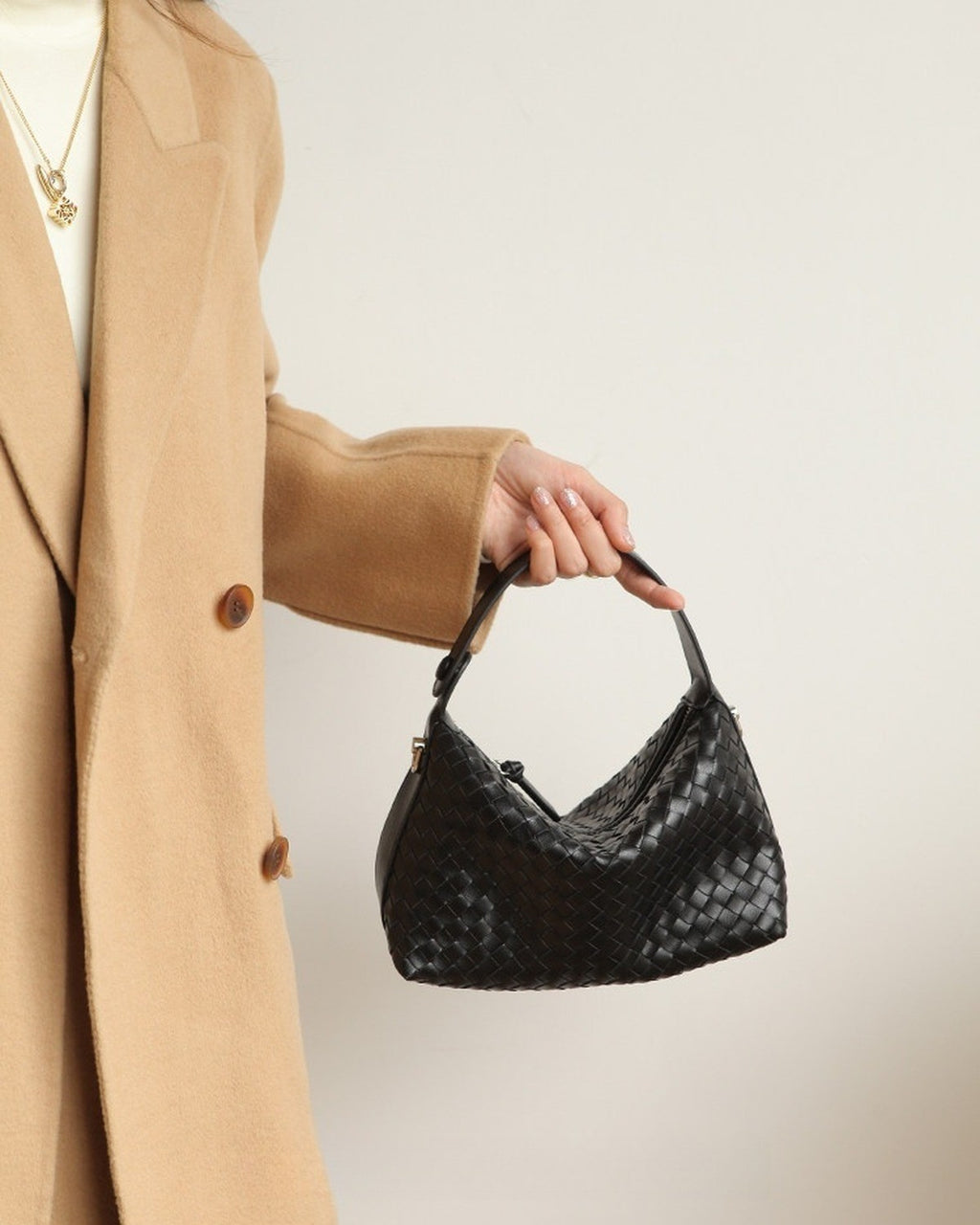 Wildfool The Parma Woven Mini Hobo in Black, carried by hand, close up (2)