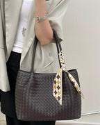 Wildfool The Vicenza Woven Tote in Espresso, carried by hand