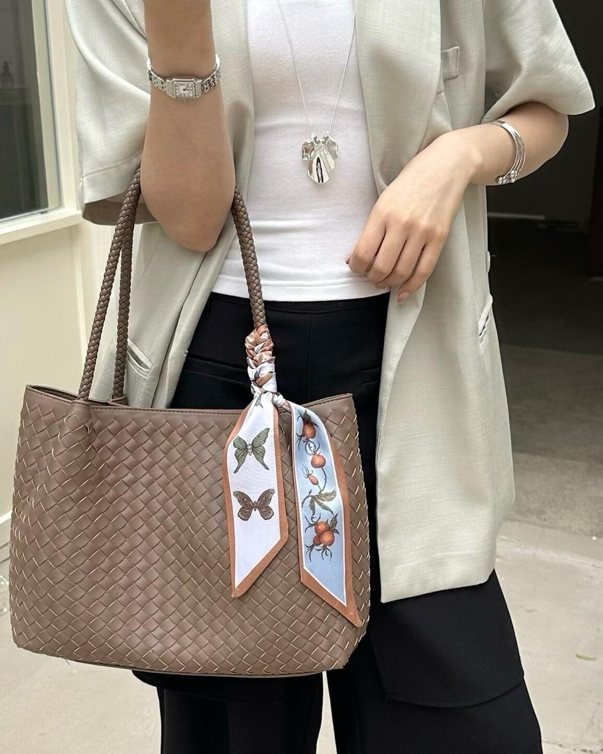 Wildfool The Vicenza Woven Tote in Brown, carried by hand