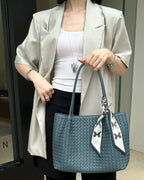 Wildfool The Vicenza Woven Tote in Dusty Blue, carried by hand