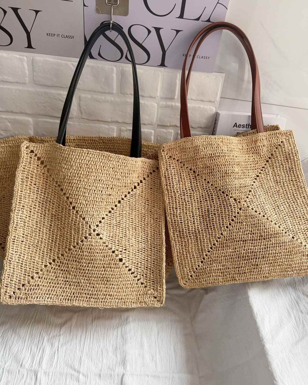 The Grand Market Tote - black and brown straps side by side