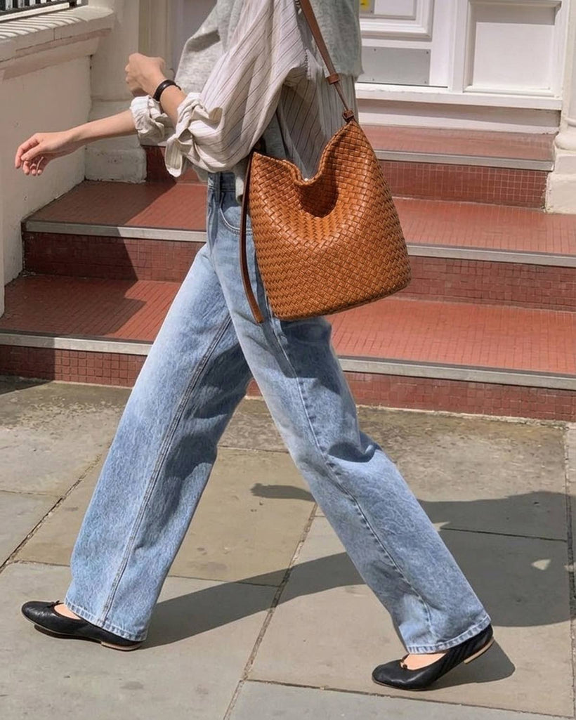 The Lecce Woven Bucket worn on the shoulder
