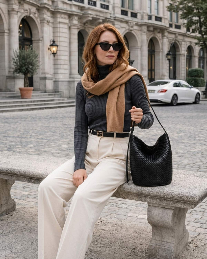 The Lecce Woven Bucket worn crossbody
